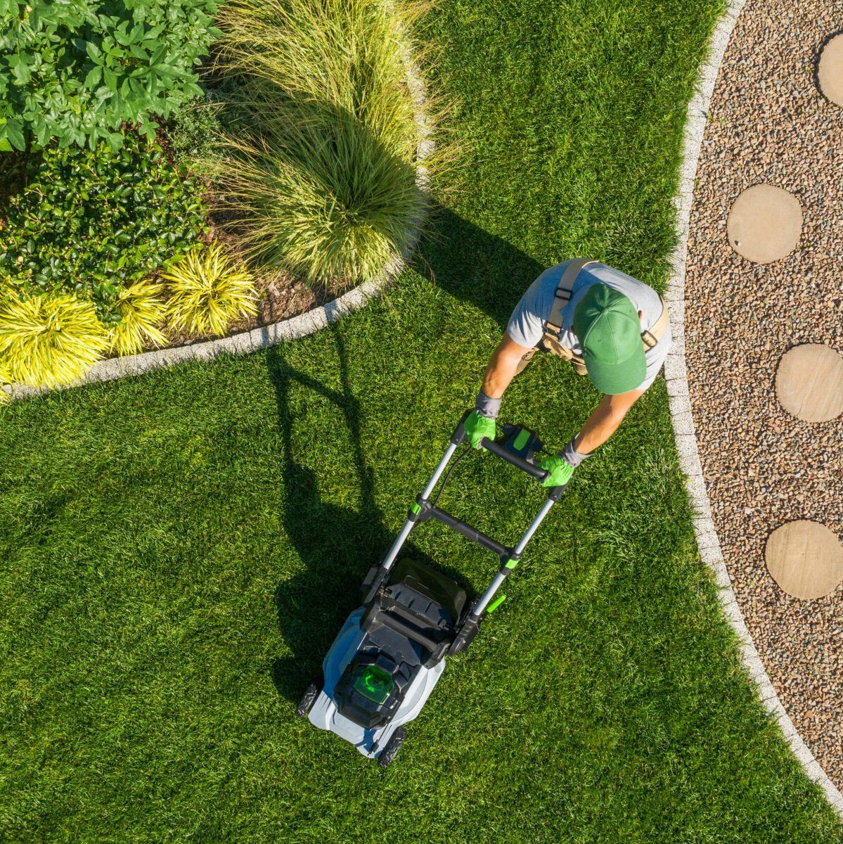 overhead view of man cutting grass